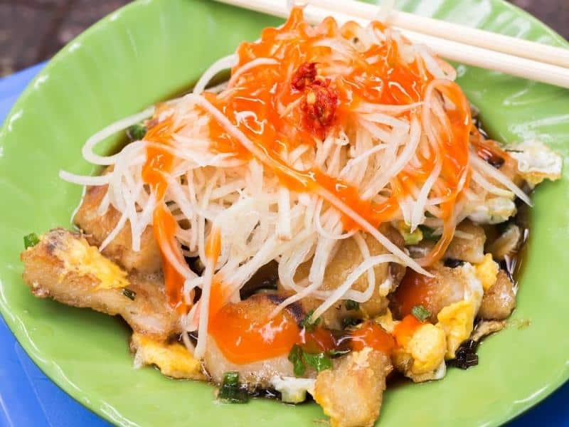 Banh bot chien, also known as Vietnamese hash browns, on a green plate