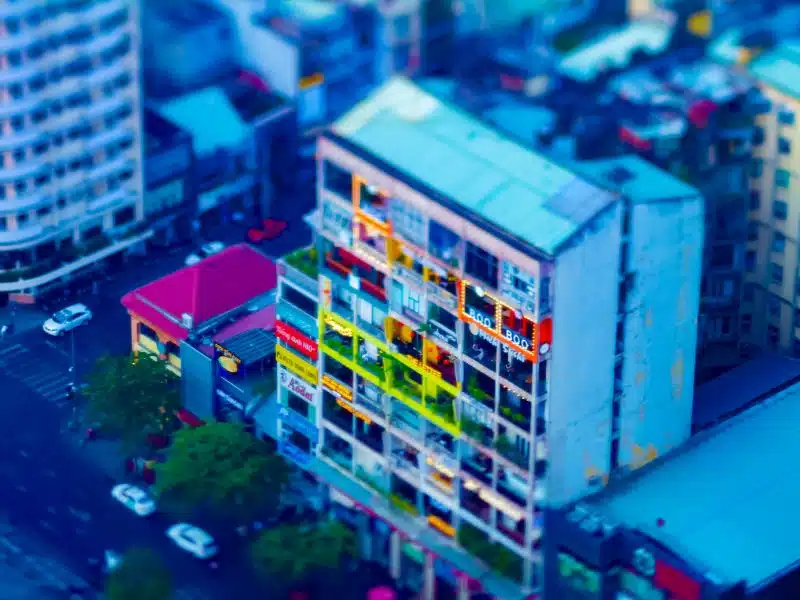 Aerial view looking down on an apartment block where every apartment is is cafe