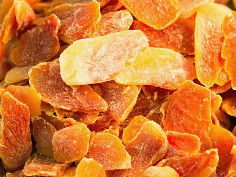 Some candied orange colored fruit in Vietnam, called mut