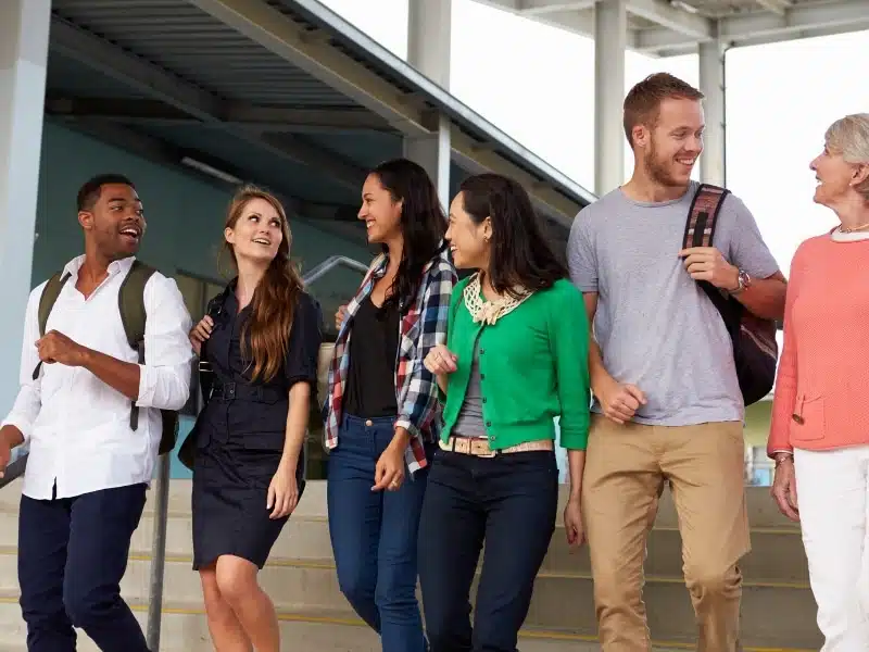 A row of English teachers descending a set of stairs