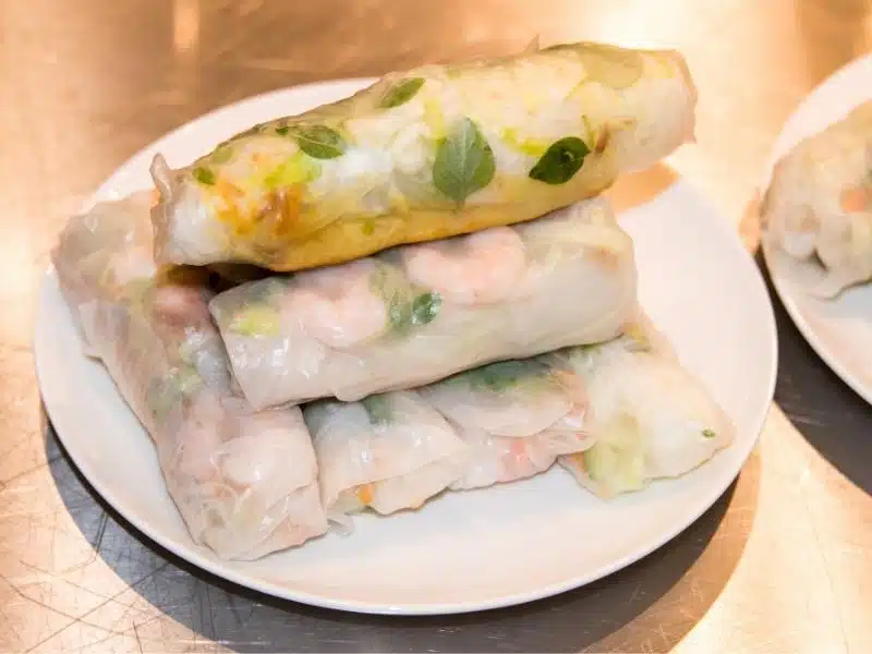 A plate of summer rolls (goi cuon) on a table in Vietnam