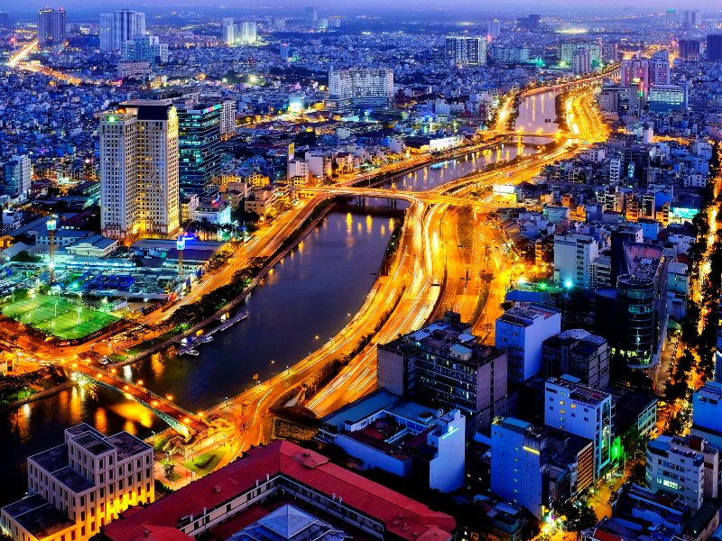 Looking down at a river winding through Ho Chi Minh City from the observation deck at Bitexco