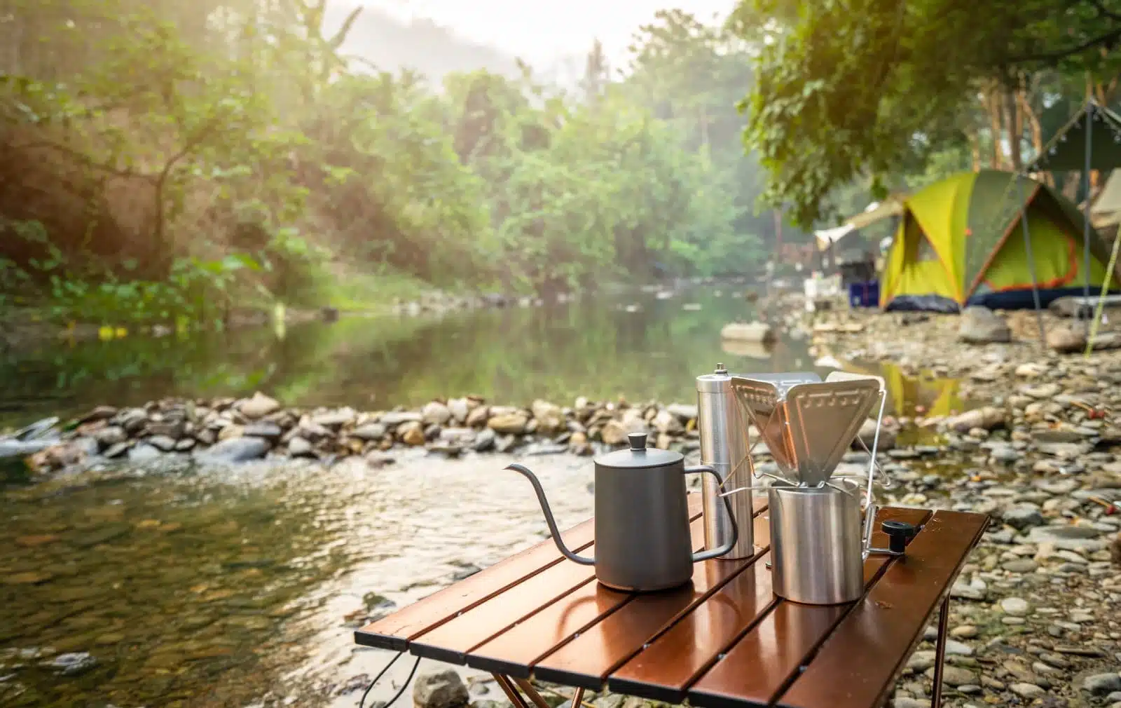 coffee drip while camping near the river in nature park